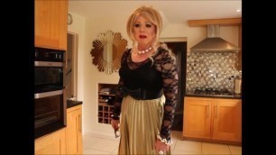 Sindy in black lace top with gold pleated skirt.