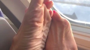 Milf feet in plane